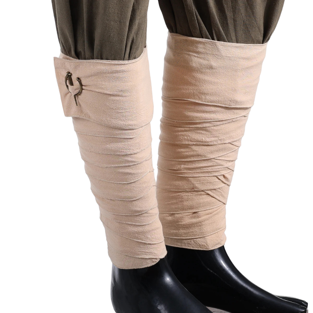 Renporium's Viking Leg Wraps in Beige. These leg wraps pair effortlessly with any medieval trousers to give your Viking look at any Renaissance Fair the perfect touch.