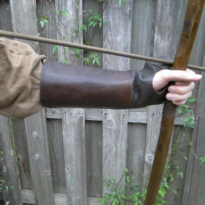 Brown laced bracer on archer's forearm, inside view, ideal for medieval cosplay.